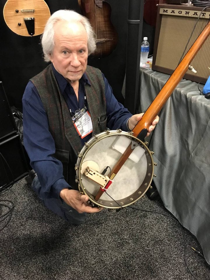 Rick Turner holds a banjo