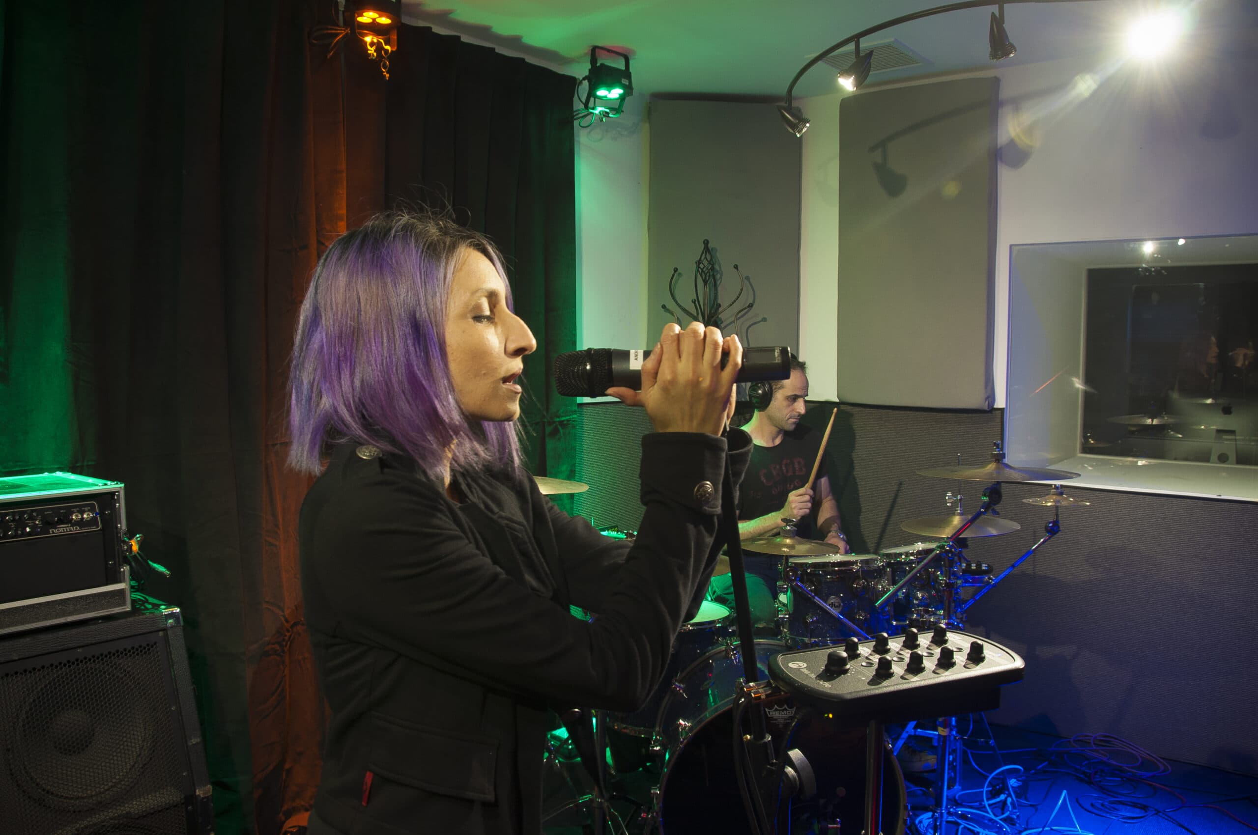 Vocalist for Android Lust rehearses with a Hear Back OCTO mixer to create a custom monitor mix. Photo courtesy of Android Lust.