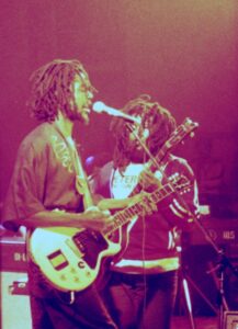 Peter Tosh (with Robbie Shakespeare in background), 1978. Courtesy of Wikimedia Commons/TimDuncan.