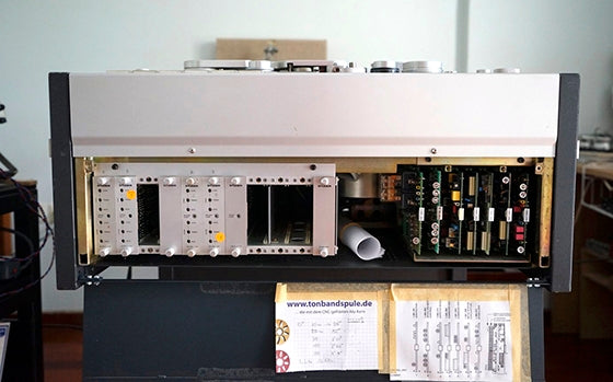 The amplifier cards of the Studer A80. The holes are for inserting a screwdriver to adjust the trim pots. Photo courtesy of George Vardis.