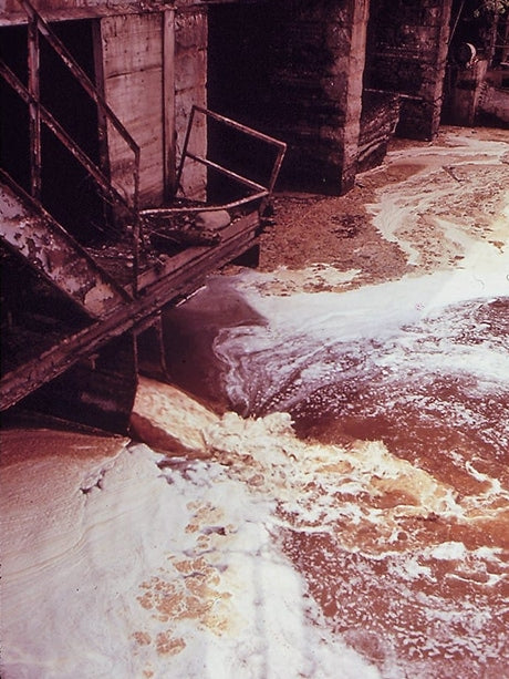 Sludge from a paper mill going into the Androscoggin River, Maine, in the 1970s. From the National Archives, photo by Charles Steinhacker.