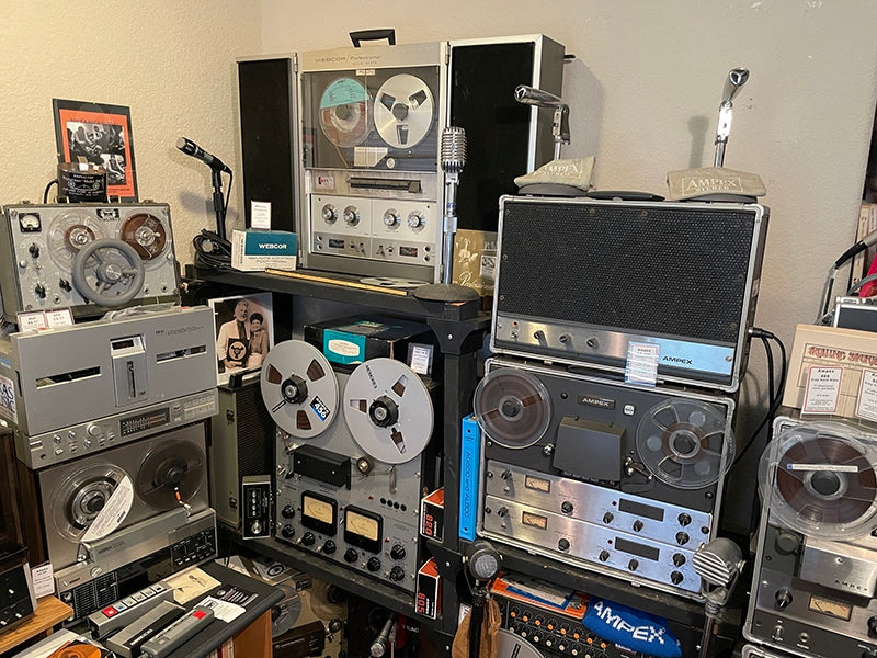 Top left: Magnemite 610 DV battery-operated portable recorder and Amplicorp Magneraser Model 200C bulk tape eraser. Below it is an Akai GX-77 auto recorder and Ampex AX-300 consumer deck. Top center: Webcor CP2550 recorder with a Tapesonic Model 70A; below that is a Concertone 505. Right: Ampex AG-500 recorder with AA-620 amp/speaker, Teac Model 1 mixer and Ampex AG-600 recorder. Also pictured are Shure, a matched pair of Ampex HO1390 (EV 623), Turner 99 and Electro-Voice 640 mics.