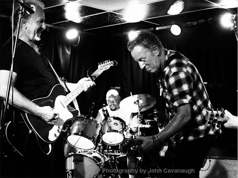 Joe Grushecky rocking with The Boss. Photo courtesy of John Cavanaugh.