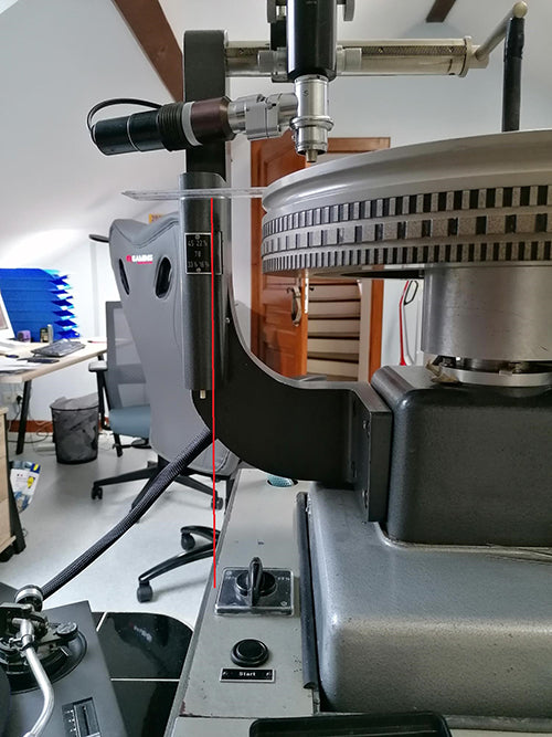 The microscope arm, bolted to the platter end of the Neumann lathe bed, carries the slide rail on which the groove inspection microscope can travel.