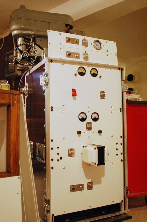 The Agnew Analog Reference Instruments Series 890 cutting amplifier rack, freshly assembled in the lab. From top to bottom, vacuum suction switchgear and vacuum gauge, stylus heat supply unit, input stage and incoming level metering for the audio signal, RIAA pre-emphasis stage, feedback amplifier and mixer, output current sensing and metering, cutter head protection unit, power amplification stage, and power supply unit. The lathe-control electronics are in a separate rack.