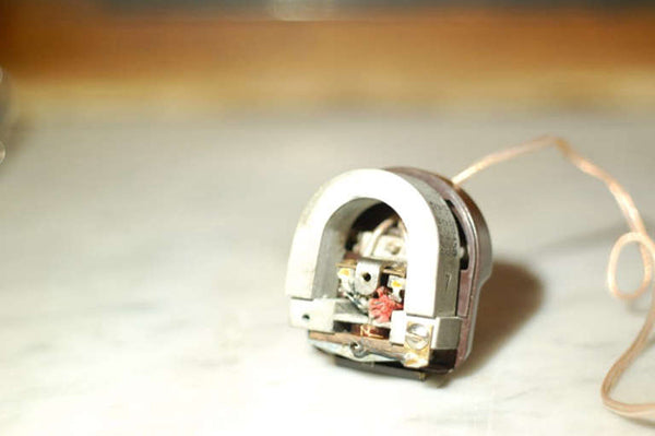 Above images: an RCA MI-4889 moving-iron monophonic cutter head. In some ways similar to the Audax seen earlier, this cutter head employs a stiff spring rod to keep the armature centered in the magnetic gap, with the pivot being held on a proprietary resilient material. An early and rather crude design, this one tends to not be as much affected by age. Here it’s in the process of being rebuilt by the author.