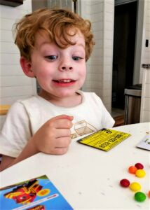 Henry, having a few Skittles after lunch.