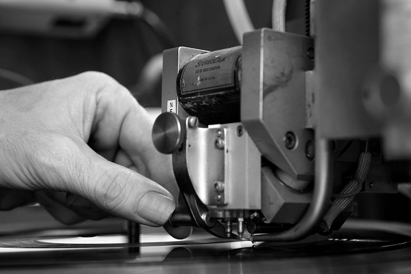 Cutting stylus (made of red ruby), with heater wire wrapped around it, and advance ball (made of clear sapphire), on a Westrex 2B cutter head. it's modified by the author to accept currently-available cutting styli, as the original Westrex taper shank is no longer available. Courtesy of Agnew Analog Reference Instruments.