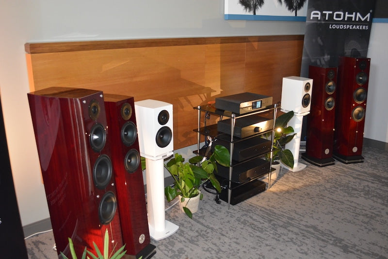 ATOHM loudspeakers and Atoll electronics in the Audio Excellent room. One of the tower models was playing "Fender Bender" by Chris Jones at pants-flapping volume, yet you could hear the subtle high-hat on the track in the midst of it all. The towers were playing "Fender Bender" by Chris Jones at pants-flapping volume, yet you could hear the subtle high-hat on the track in the midst of it all.