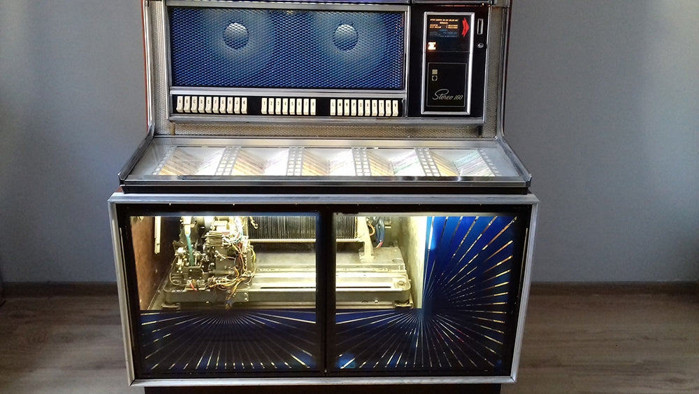 A 1969 Seeburg LS2 jukebox, heavily modified by Jędrzej, with the carriage and bank rotated 180 degrees for better visibility, assisted by custom front door glass.