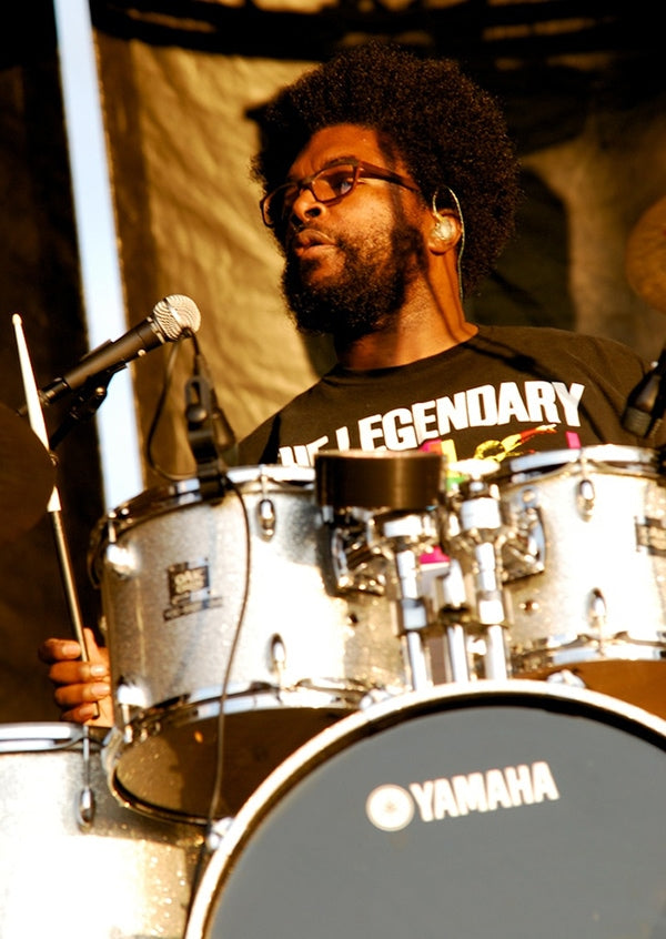 Questlove using IEMs in concert. Courtesy of Wikimedia Commons/Brennan Schnell.