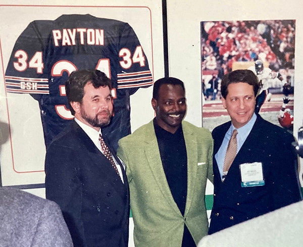 Walter Payton (center) with Fuji executives.