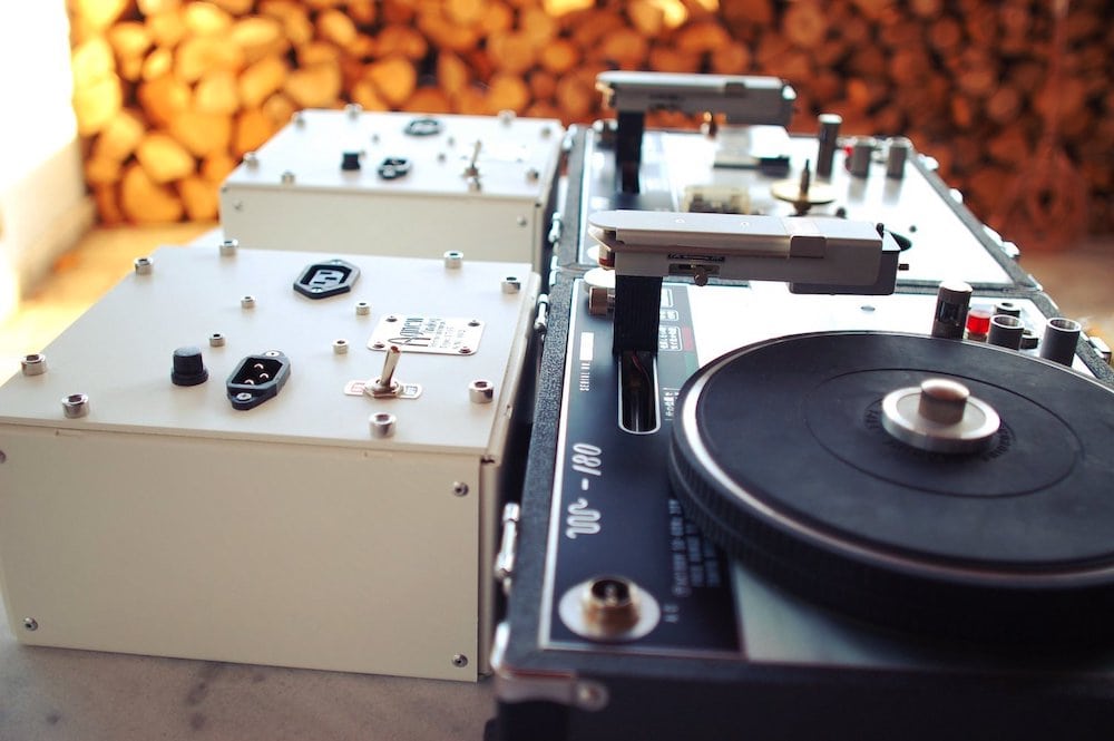 Two Hara M-180 disk recorders with Agnew Analog power supply units, undergoing final assembly and testing upon restoration on the patio at Agnew Analog headquarters. Courtesy of Agnew Analog Reference Instruments/Sabine Agnew.