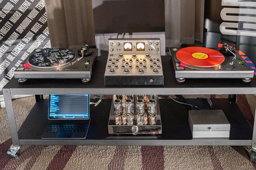 The Common Wave HiFi room. The Los Angeles audio dealer was showing a Technics SL-1210 MK II turntable, Varia Instruments RDM40 fully analog mixer, and a Merason DAC, among other products.