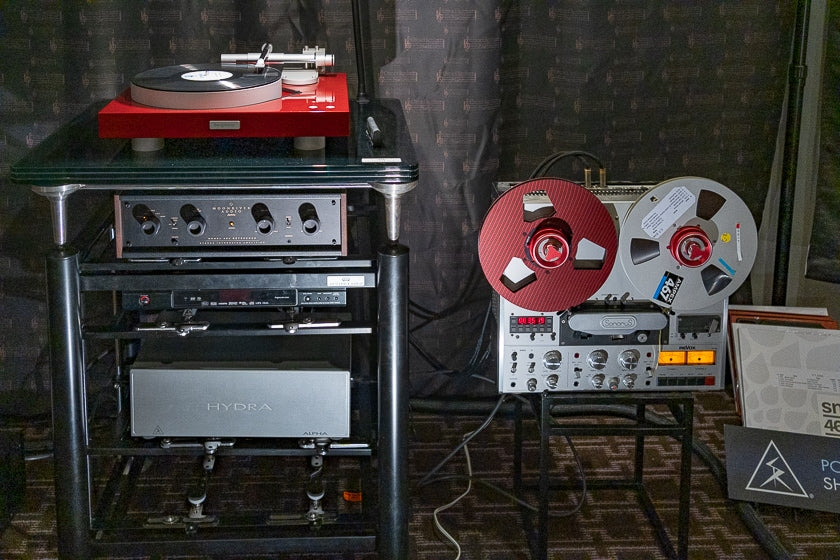 A SonoruS Audio-modified Revox PR99 reel-to-reel deck along with the Bergmann Modi/Thor/Hana turntable/cartridge setup, Moonriver Audio 404 integrated amplifier, Shunyata Research cables and power conditioners, and Artesania Audio rack.