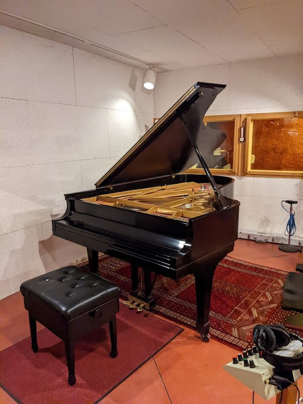 The studio's grand piano.