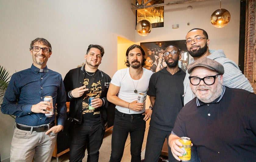 Dave Trumfio of Gold-Diggers, and other folks enjoying a drink during the Sony 360 Reality Audio demonstrations.