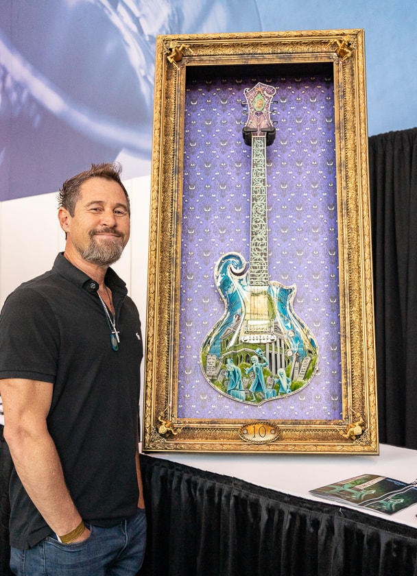 The Disney-authorized Haunted Mansion Guitar, and Marc Minarik from Minarik Guitars at the NAMM Media Preview Day.