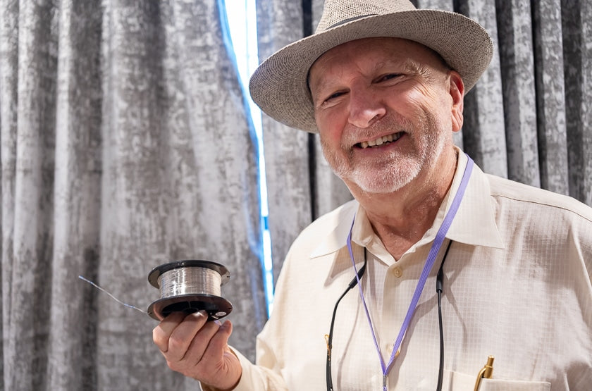 Ernie Meunier of ArgentPur cables, holding up a spool of pure silver wire used in their construction.