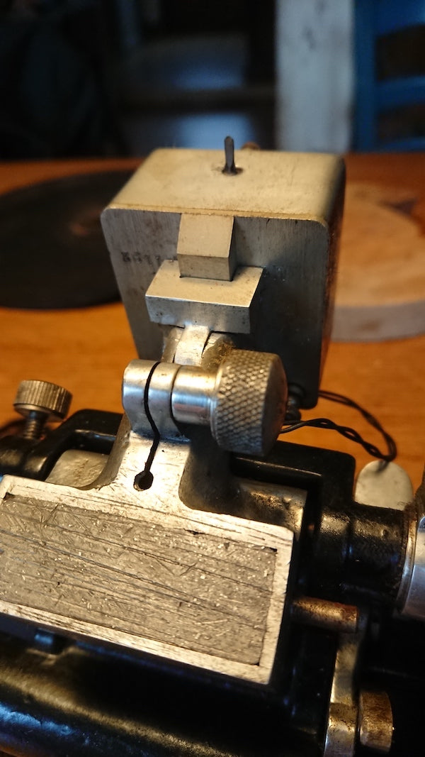 A cutter head mount for a French recording lathe.