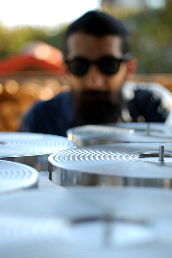 J.I. Agnew inspecting a batch of vacuum platters.