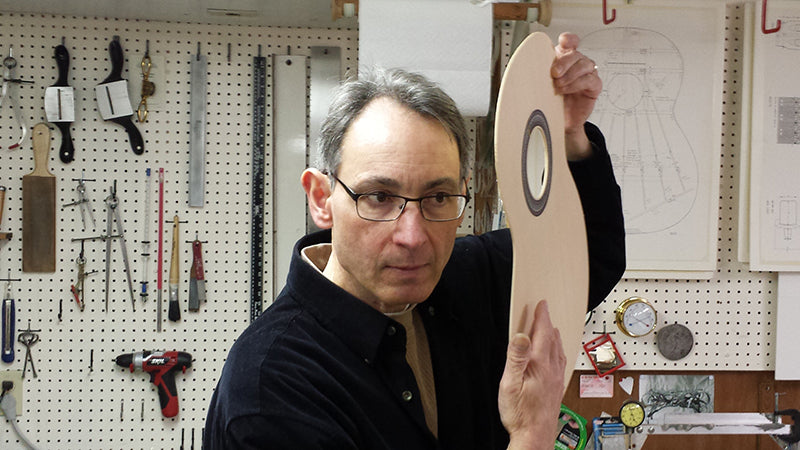 Juan Oscar Azaret tap-testing the soundboard of a guitar. Courtesy of Marian Goldsmith.